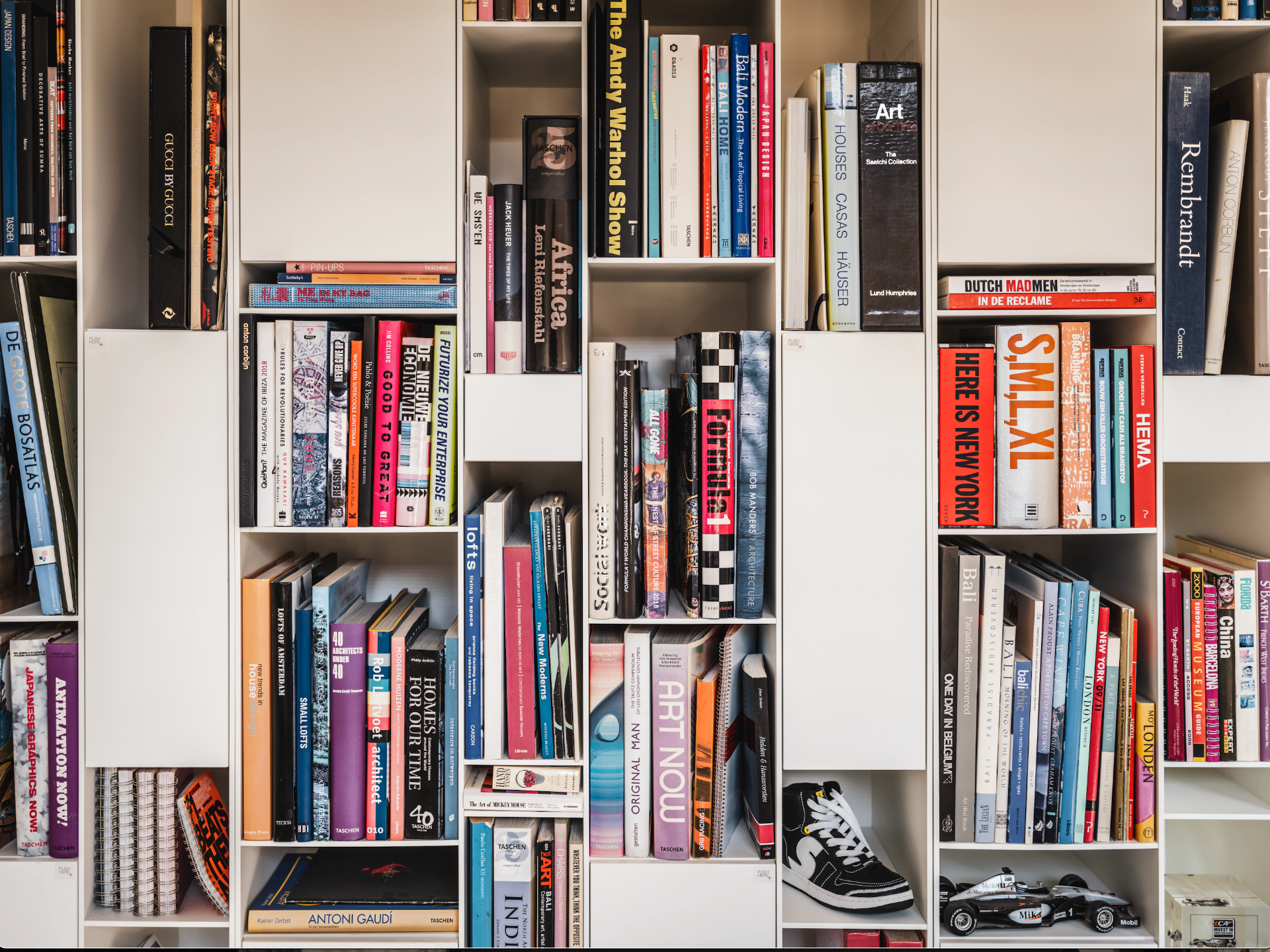Curated art and design book library wall